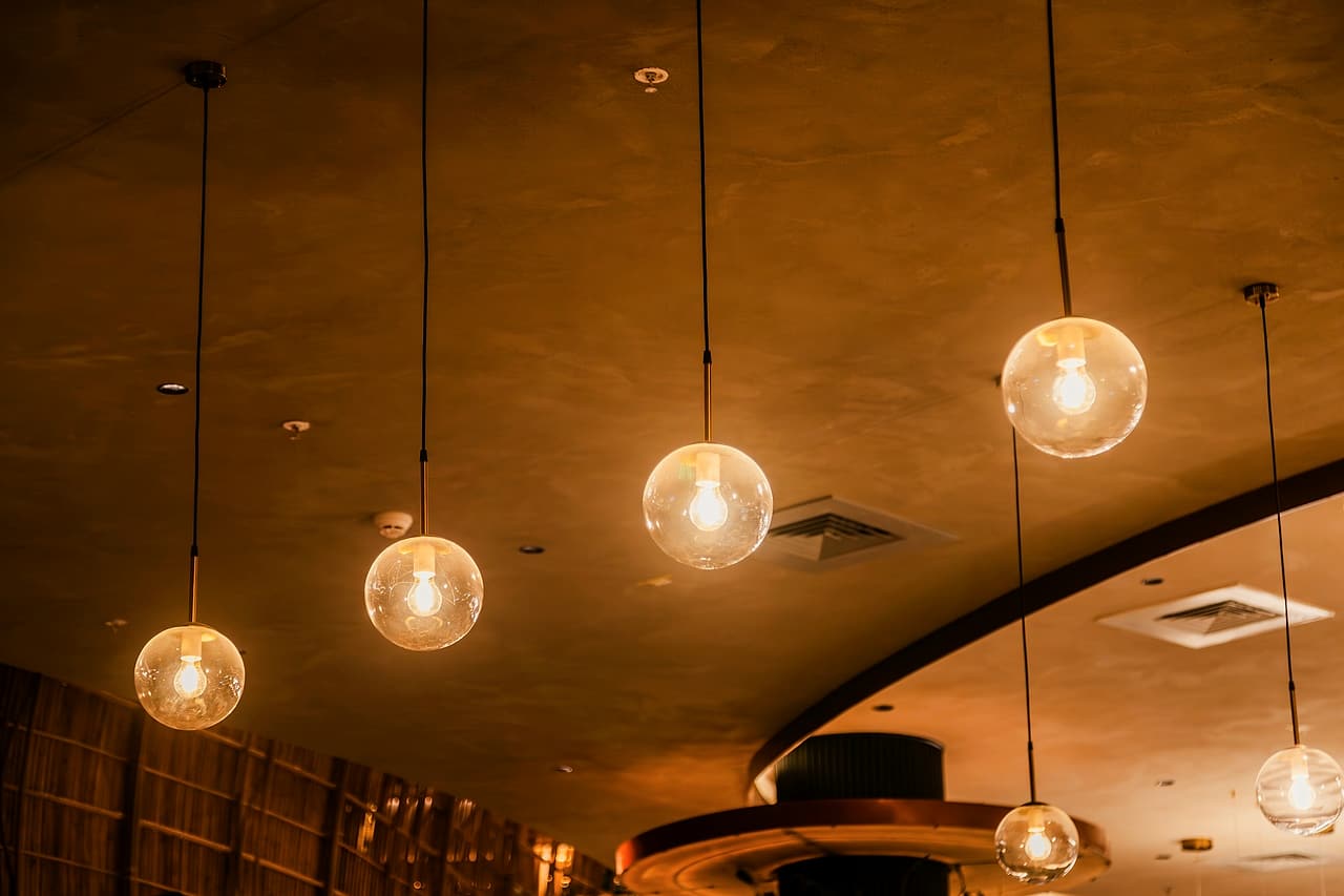 Decorative glass pendant lights installed in a finished interior.