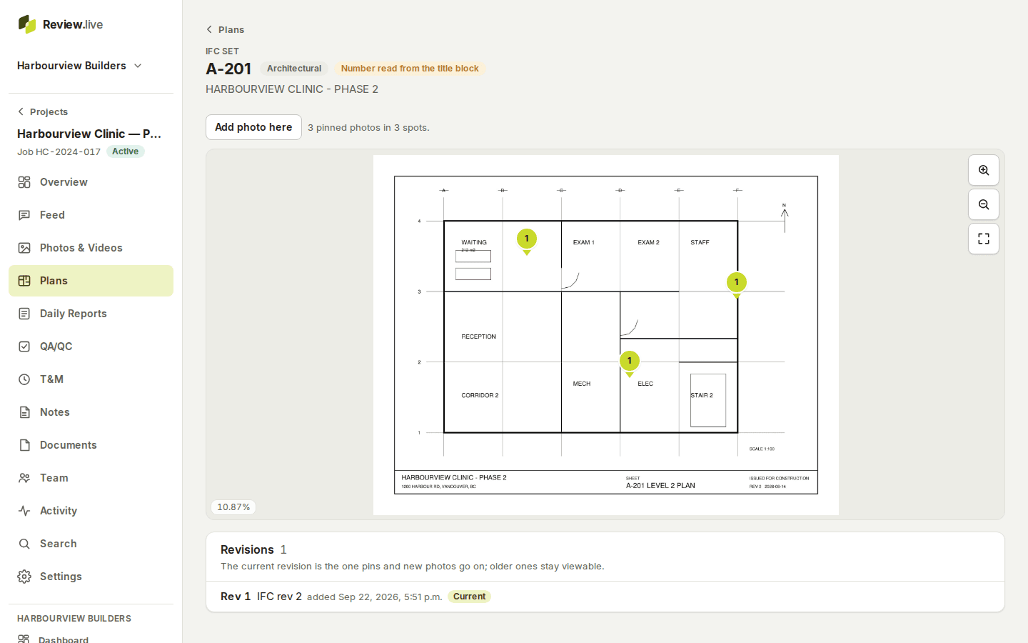A plan sheet on a desktop: A-201, Architectural, 'Number read from the title block', the drawing with three numbered pins, zoom controls, and the revisions list below.
