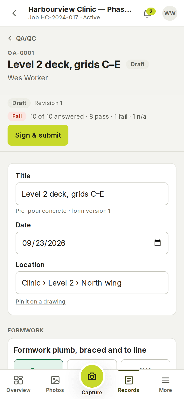 An inspection on a phone: QA-0001, Level 2 deck, grids C–E, marked Draft with '10 of 10 answered · 8 pass · 1 fail · 1 n/a', the Sign & submit button, and the title, date and location fields.